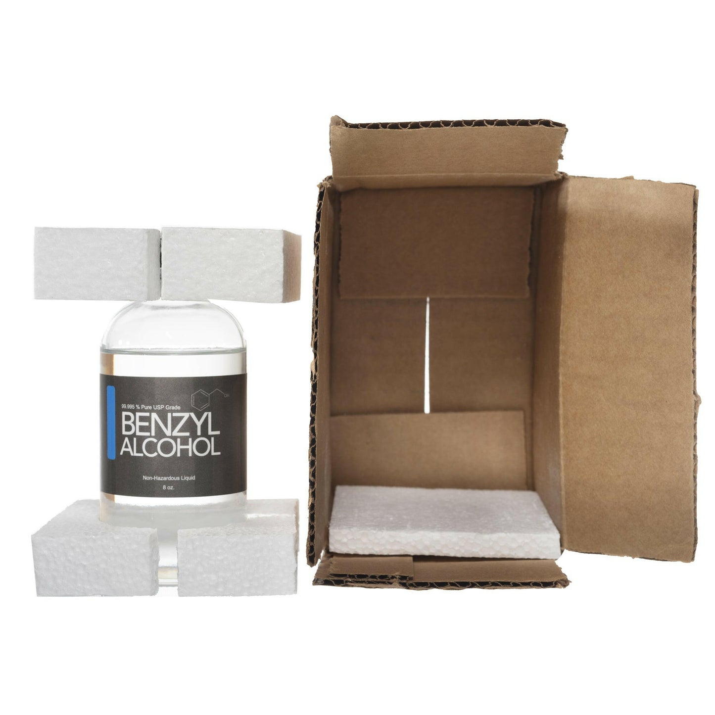 Clear glass bottle with a black plastic twist off cap. Label reads "Benzyl Alcohol non hazardous liquid" 8 oz. Product is shown on the side of a brown cardboard box. There is Styrofoam on the top and the bottle of the glass bottle.