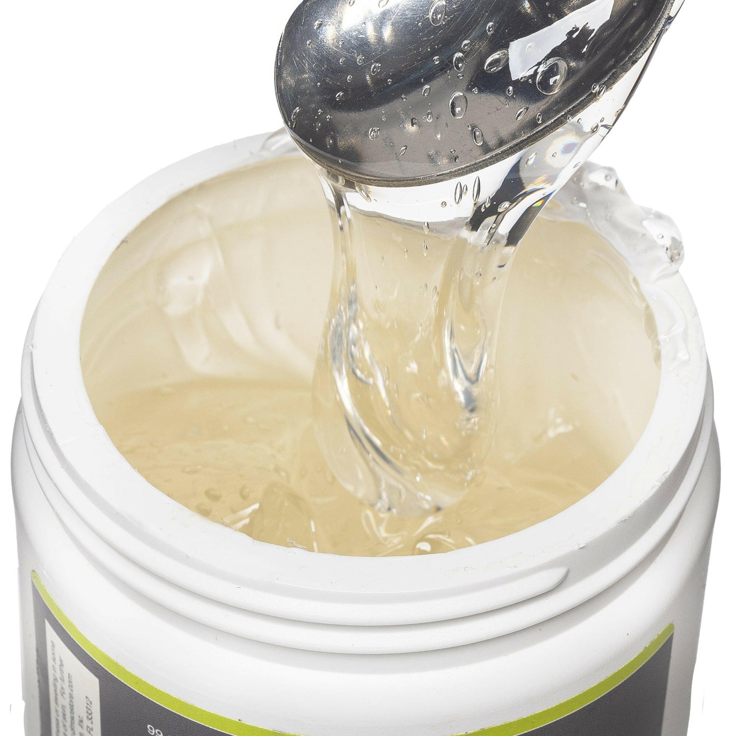 Opened view of the 16 oz medi gel jar. Contents revealed is the medi gel product. Product is being scooped upwards with a spoon to show consistency.