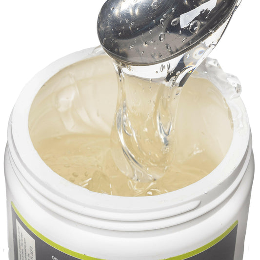 Opened view of the 16 oz medi gel jar. Contents revealed is the medi gel product. Product is being scooped upwards with a spoon to show consistency.
