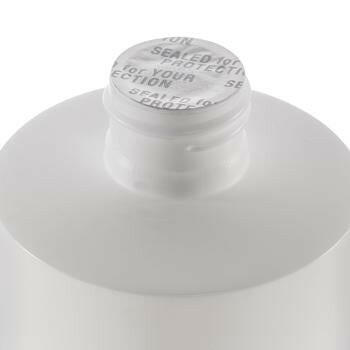 Close up of seal that is located under cap. Seal is silver and reads "sealed for your protection"