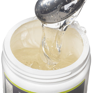 DMSO-aloe-Gel-dimethyl-sulfoxide-buy-best-Closeup. Opened view of the 16 oz 70/30 aloe vera gel jar. Contents revealed is the Aloe Vera gel product. Product is being scooped upwards with a spoon to show consistency.