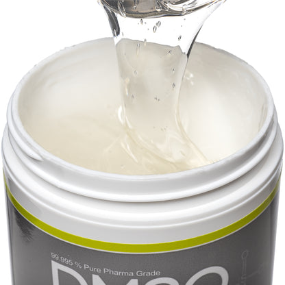 DMSO-gel-99.995-pure-dimethyl-sulfoxide-muscle-pain-closeup. Opened view of the 16 oz medi gel jar. Contents revealed is the medi gel product. Product is being scooped upwards with a spoon to show consistency.