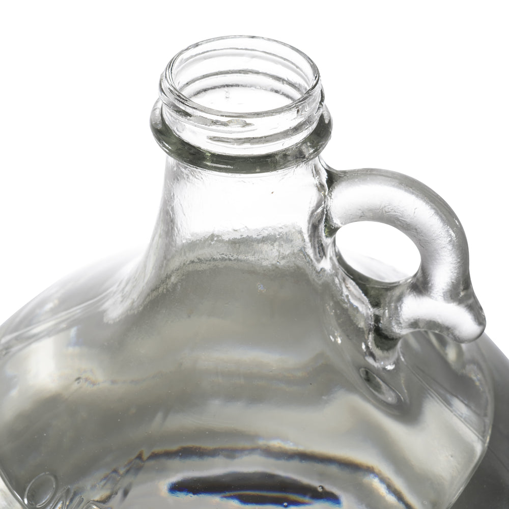 one gallon glass jugs with handle. Close up of the opening of the glass jug without the cap attached to it. 