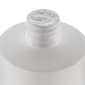 DMSO-liquid-99.995-pure-dimethyl-sulfoxide-joint-pain-non-diluted-8-oz-cap. Close up of seal that is located under cap. Seal is silver and reads "sealed for your protection"